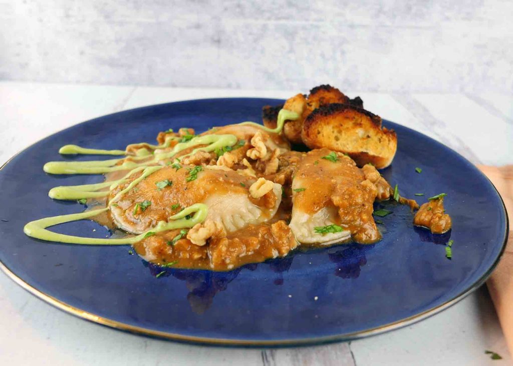 Vegan pumpkin ravioli with garlic crostini by Roaring Spork